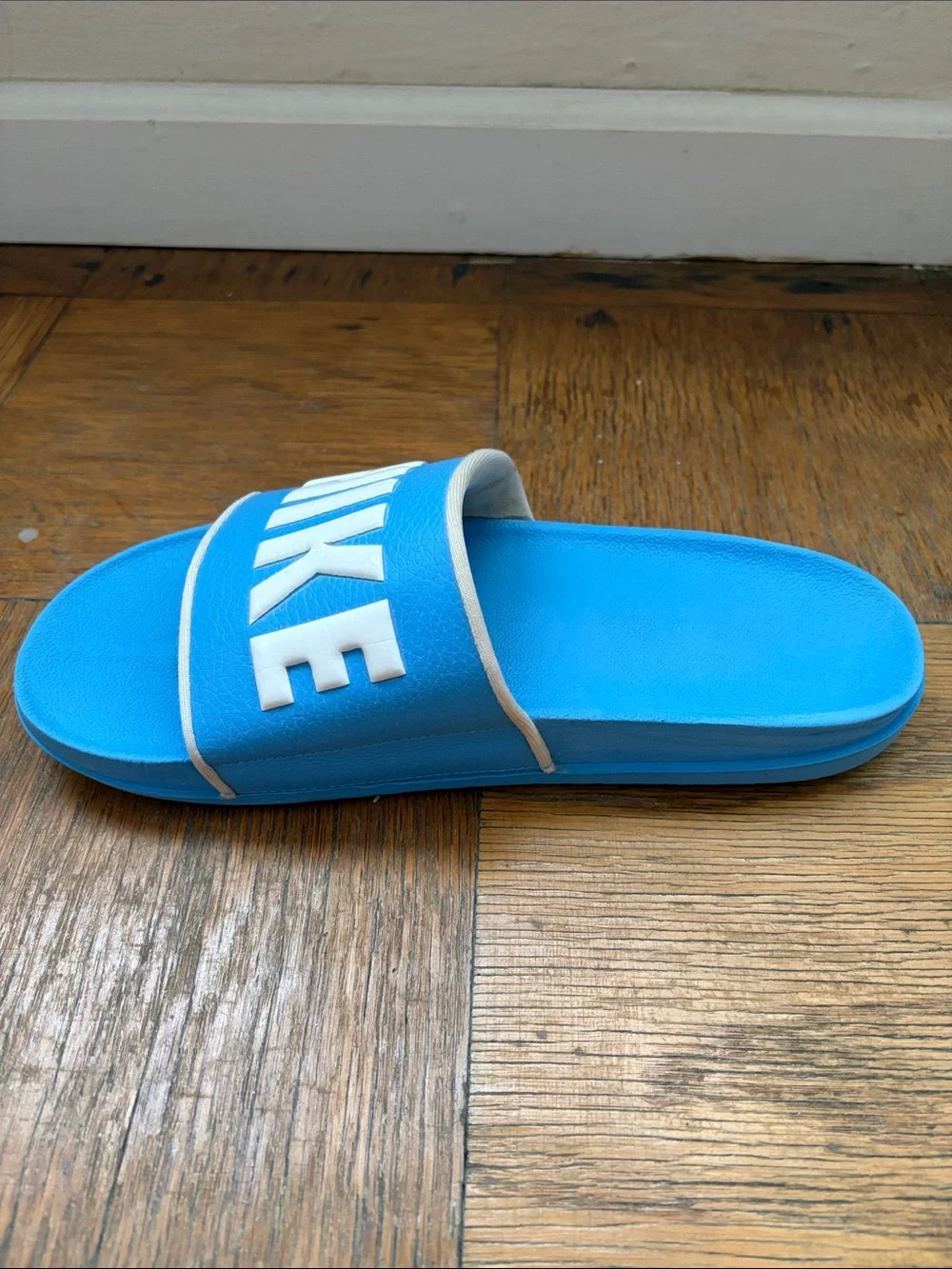 Nike Men’s Light Blue Slide Sandals with White NIKE Logo